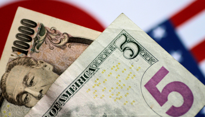 US dollar and Japan yen notes are seen in this photo illustration June 2, 2017.