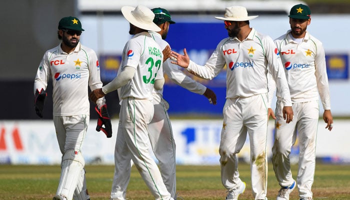 Pakistani players walk back to the pavilion at the end of Sri Lanka first innings during the first Test.