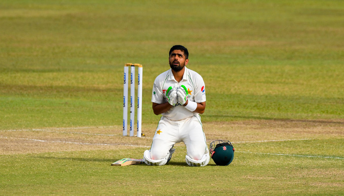 Pakistans captain Babar Azam celebrates after scoring a century (100 runs) during the second day of the first cricket Test match between Sri Lanka and Pakistan at the Galle International Cricket Stadium in Galle on July 17, 2022. - AFP