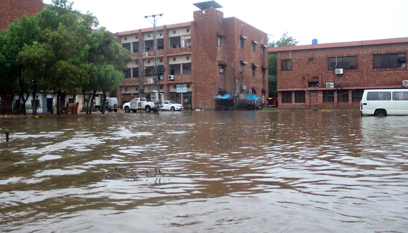 A view of accumulated rainwater at Shahbaz Building (District Headquarter) after heavy rainfall in the city. —Online