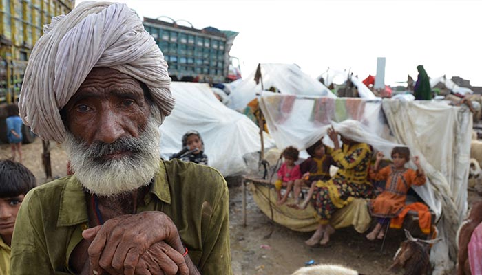 Villagers take shelter at a makeshift camp after their homes were damaged by flooding following monsoon rainfalls in Jaffarabad district in Balochistan province on August 24, 2022. — AFP