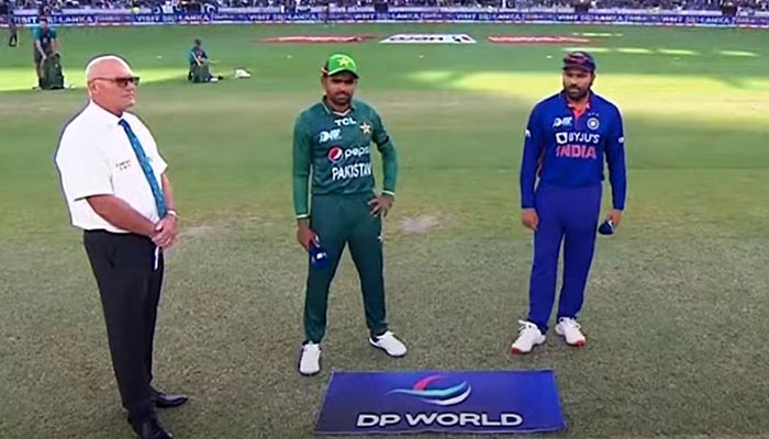 Pakistans captain Babar Azam (L) and Indian captain Rohit Sharma stand in the field during the toss in Asia Cup 2022. — Screengrab/Twitter