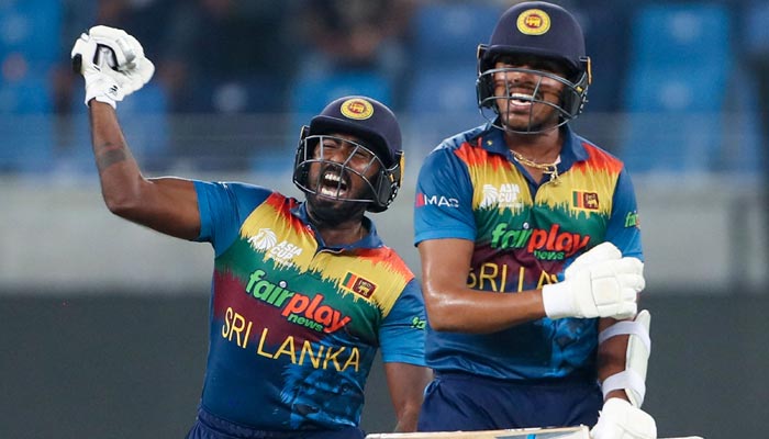 Sri Lankas Asitha Fernando (L) and Maheesh Theekshana celebrate their win during the Asia Cup Twenty20 international cricket match between Bangladesh and Sri Lanka at the Dubai International Cricket Stadium in Dubai on September 1, 2022. — AFP/File