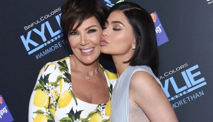 Kylie Jenner sips martini as she launches new cosmetics line with mom Kris Jenner