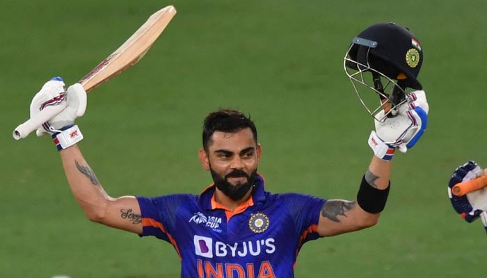 India´s Virat Kohli celebrates after scoring a century (100 runs) during the Asia Cup Twenty20 international cricket Super Four match between Afghanistan and India at the Dubai International Cricket Stadium in Dubai on September 8, 2022. — AFP