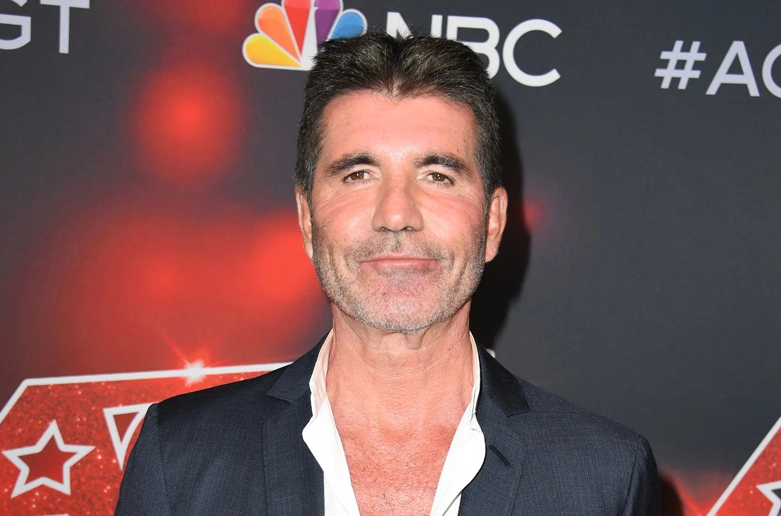 Simon Cowell Shows Support For Harry Styles After Spitgate Incident