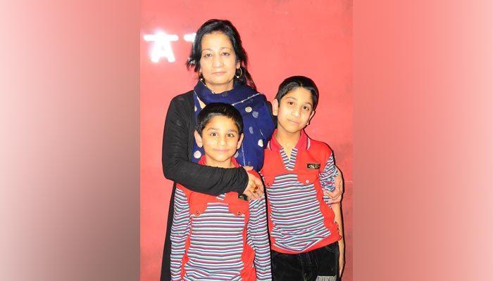 Shumaila Imran Farooq with her two sons. — Twitter/@shumailasyeda/File