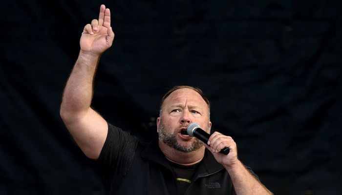 In this file photo taken on December 12, 2020, US far-right radio show Alex Jones speaks to supporters of US President Donald Trump in Washington, DC.— AFP