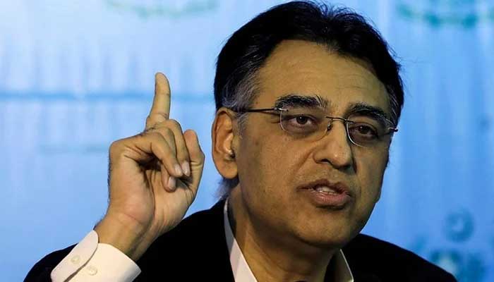 Asad Umar addresses a press conference. — AFP/File