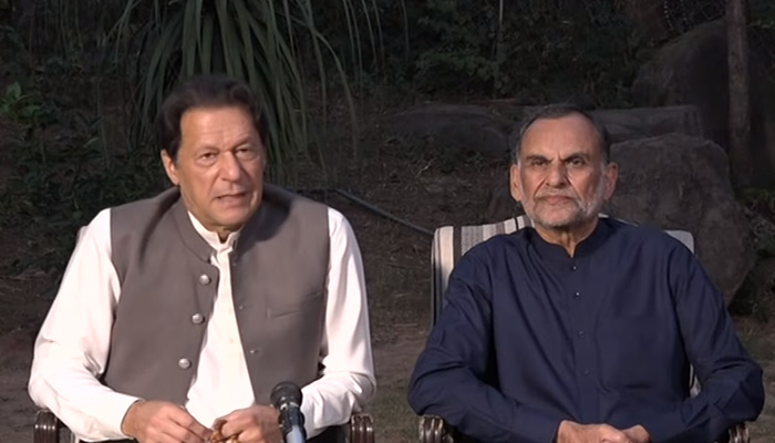 Former prime minister and PTI chief Imran Khan (L) adressing a press conference along with Senator Azam Swati in Islamabad on October 23, 2022. — YouTube Screengrab via Geo News Live