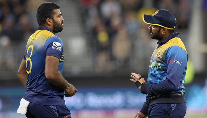 Sri Lankas Bhanuka Rajapaksa (R) talks to Lahiru Kumara during the ICC mens Twenty20 World Cup 2022 cricket match between Australia and Sri Lanka at Perth Stadium on October 25, 2022 in Perth. — AFP