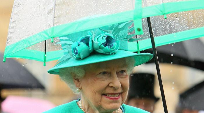 Why the Queen insisted on always holding her own umbrella