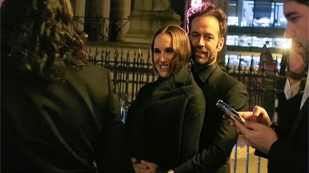 Natalie Portman in high sprits as she snuggles up to husband Benjamin Millepied