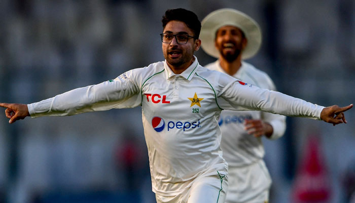 Pakistan’s Abrar Ahmed (C) celebrates after taking wicket of England’s Zak Crawley (not pictured) during the first day of the third cricket Test match between Pakistan and England at the National Stadium in Karachi on December 17, 2022. — AFP