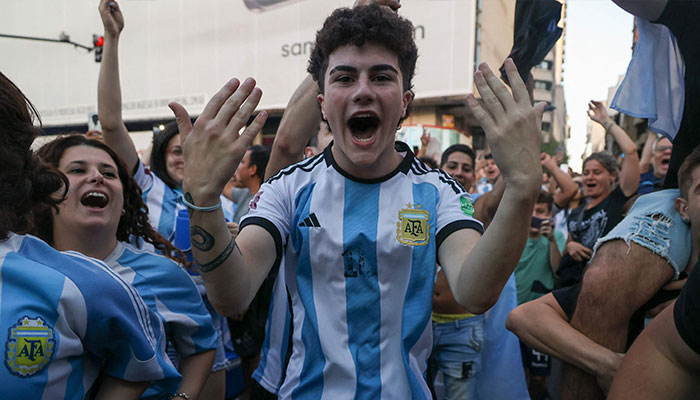 Fans of Argentina celebrate winning the Qatar 2022 World Cup against France at 9 de Julio avenue in Buenos Aires, on December 18, 2022. — AFP/File