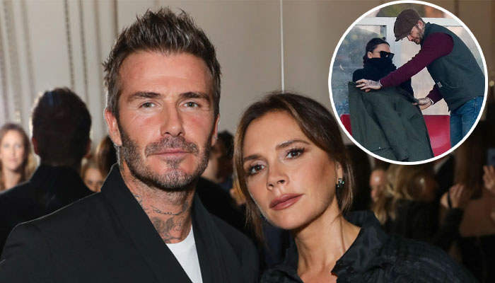 David Beckham wraps wife Victoria in his jacket during son Romeo’s ...