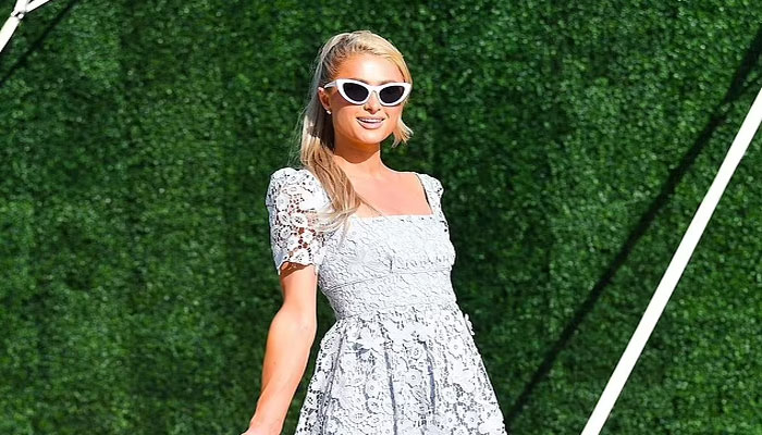 Paris Hilton shows off mommy glow in latest outing with hubby Carter Reum after welcoming son via surrogate