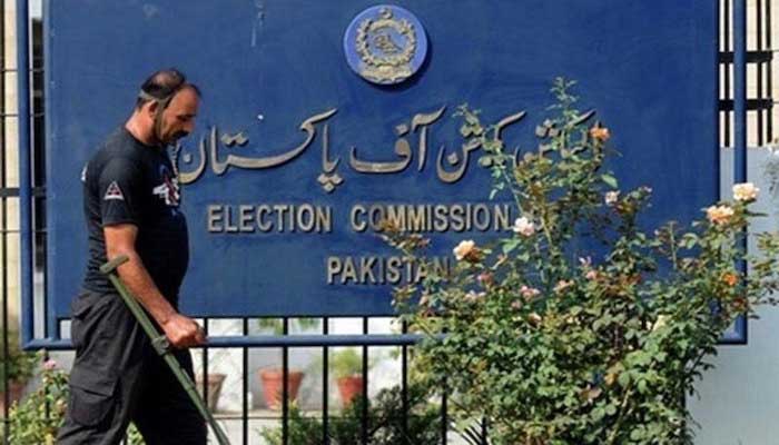 A security official moves outside Pakistans election commission building in Islamabad in this undated photo. — AFP