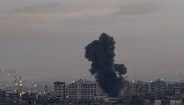 Smoke rises above buildings in Gaza City as Israel launched air strikes early on February 23, 2023.— AFP