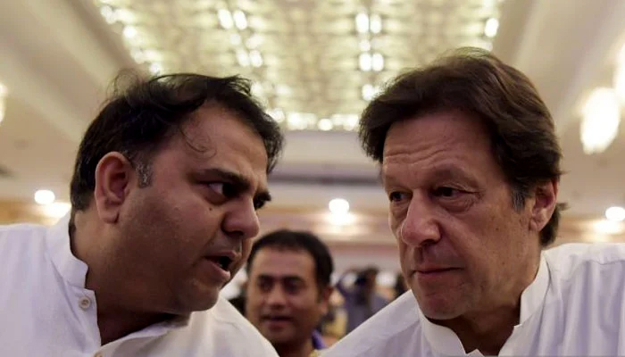 In a file photo, Fawad Chaudhry is seen in a conversation with Imran Khan.