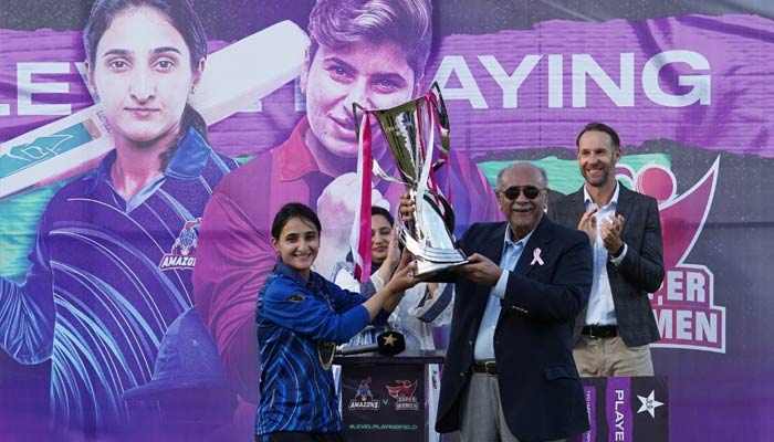 Amazons Captain Bismah Maroof lifts the trophy with PCB management committee chairman Najam Sethi after winning the Womens League Exhibition matches series. — Twitter/@TheRealPCB