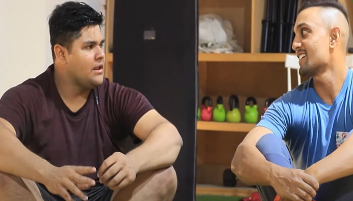 Pakistan cricket teams hard-hitter Azam Khan (left) talks to his trainer Shehzar Mohammad. — Screengrab/ YouTube/ Khel Shel