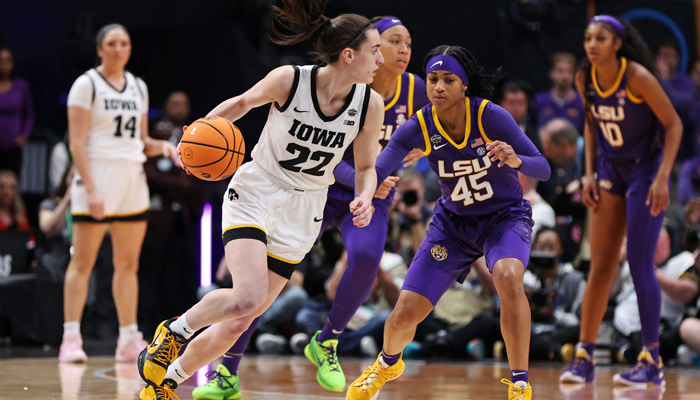 Caitlin Clark of the Iowa Hawkeyes dribbles against Alexis Morris of the LSU Lady Tigers during the first quarter during the 2023 NCAA Womens Basketball Tournament championship game at American Airlines Center on April 02, 2023, in Dallas, Texas. — AFP