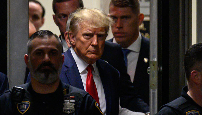 Former US President Donald Trump makes his way inside the Manhattan Criminal Courthouse in New York on April 4, 2023.—AFP/file