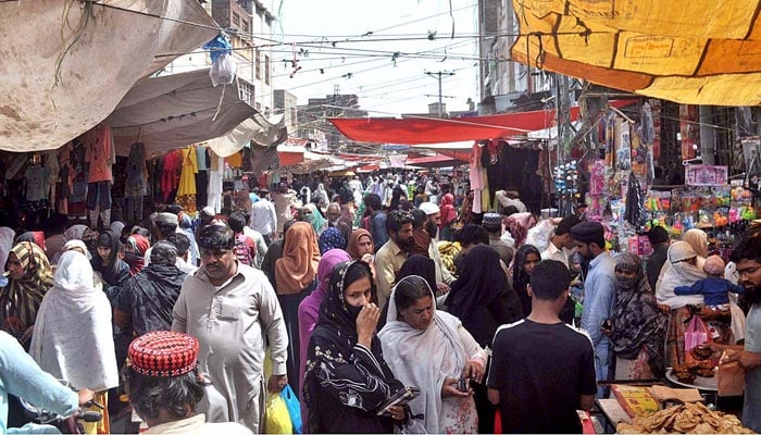 People are busy shopping for the Eid ul Fitr festival at Urdu Bazar, Sargodha on April 18, 2023. — APP