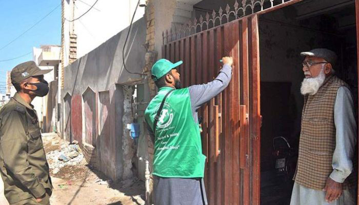 An official from the Pakistan Bureau of Statistics (PBS) collects a citizens data during the ongoing seventh population census in Sargodha on March 7, 2023. — APP/File