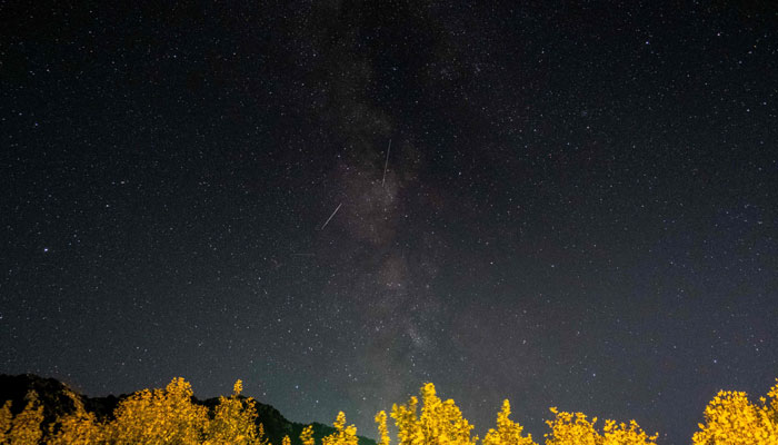 Meteors of the Orionid meteor shower streak as they cross through the Milkyway in the mountainous area of Tannourine in northern Lebanon. — AFP/File