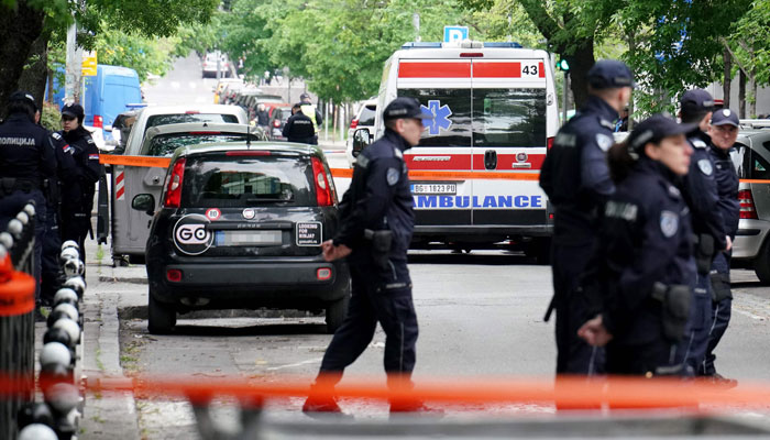 Ambulances and police officers arrive following a shooting at a school in the capital Belgrade on May 3, 2023. — AFP