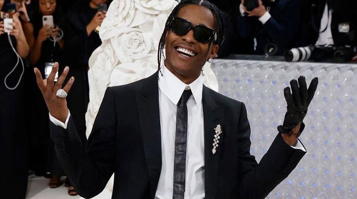 A$AP Rocky jumps over fence using fan's face as 'springboard' to get into  hotel before Met Gala and her look says it all