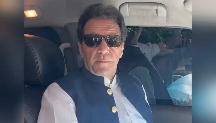 PTI Chairman Imran Khan in addresses party workers ia a video message before leaving for Islamabad to attend heraing of bail applications on May 9, 2023, in this still taken from a video. — Twitter/@PTIofficial