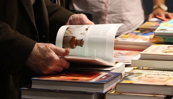 People look at books at a book-fair. — AFP/File