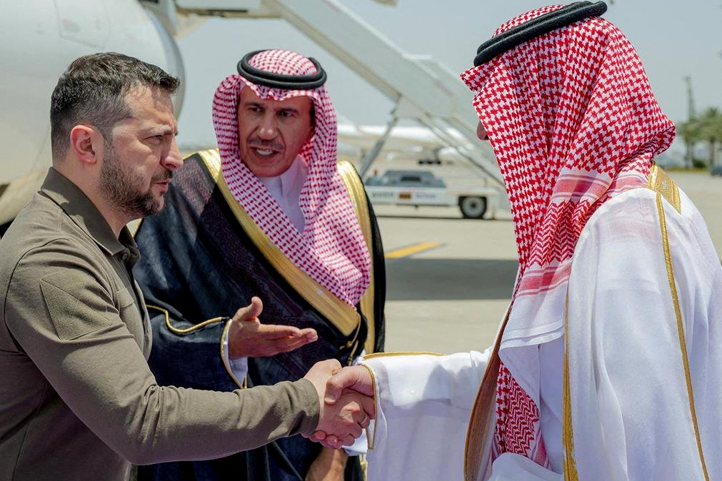 This handout picture provided by the official Saudi Press Agency SPA, shows Deputy Emir of Mecca Prince Badr bin Sultan bin Abdulaziz (R) welcoming Ukraine´s President Volodymyr Zelensky (L) in Jeddah where he arrived on May 19, 2023 to participate in the Arab League Summit. — AFP