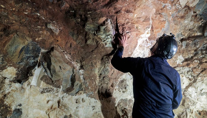 Professor Lee Berger, palaeontologist, explorer and member of The National Geographic Society, gestures as he explains the scientific relevance of discovering Homo Naledi in the Rising Star caves system in The Cradle of Human Kind, on May 11, 2023.— AFP