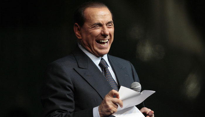 Italian Prime Minister Silvio Berlusconi delivers a speech during the Festa della Liberta (The freedom festival) organised by his party Il popolo della Liberta (the people of freedom) on October 5, 2008, in Milan. — AFP