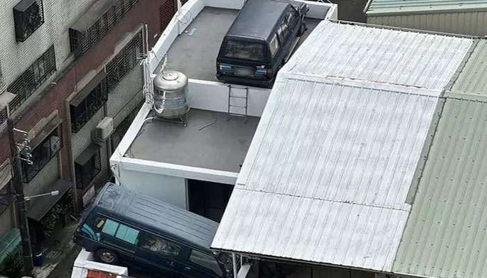 This picture shows the manss vans parked on his apartments roof. — CNA/File