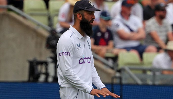 England´s Moeen Ali fields on the boundary during play on day three of the first Ashes cricket Test match between England and Australia at Edgbaston in Birmingham, central England on June 18, 2023. — AFP