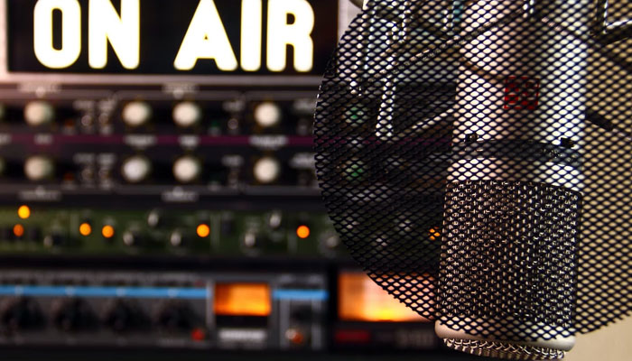 This representational picture shows a microphone inside a radio studio. — Unsplash/File