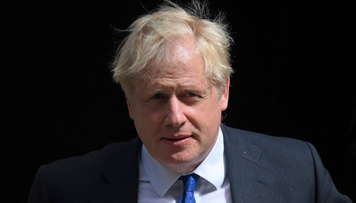 Britain´s then-prime minister Boris Johnson leaves 10 Downing Street in central London on July 6, 2022 to head to the Houses of Parliament for the weekly Prime Minister´s Questions (PMQs) session. — AFP