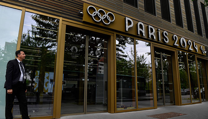 A security member stands at the entrance of the headquarters of the Paris 2024 Olympics (Cojo) headquarters as Police raided just over a year out from the opening ceremony of the quadrennial sporting showpiece, in Saint-Denis, northern Paris, on June 20, 2023.—AFP