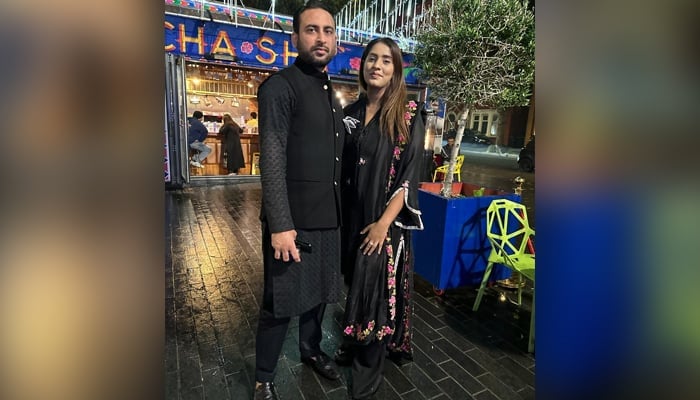 Pakistani couple — Imran Gulzar and Iqra Zahoor — posing outside the famous London cafe Cha Sha. — Author