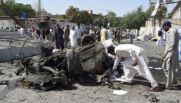 Pakistani security officials inspect the site of a powerful explosion that targeted a police vehicle in Quetta - AFP/File