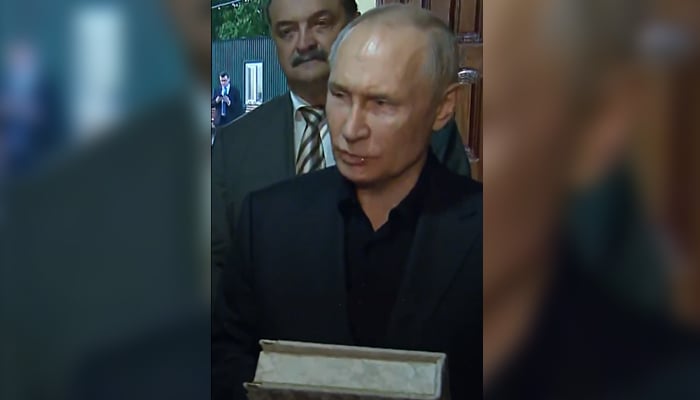 In this still taken from a video, Russian President Vladimir Putin holds a copy of the Quran during his visit to Derbent in the Dagestan Autonomous Republic, on June 28, 2023. — Twitter/@TRTWorld