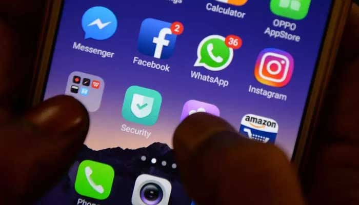 This file photo taken on March 22, 2018, shows apps for WhatsApp, Facebook, Instagram and other social networks on a smartphone in Chennai. — AFP