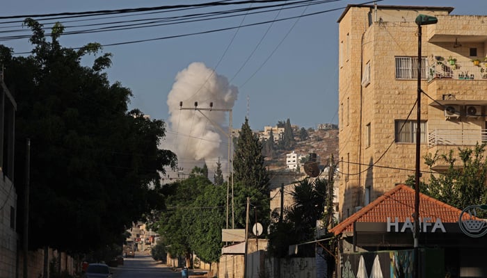 Smoke billows following an Israeli airstrike in the occupied West Bank city of Jenin on July 3, 2023. — AFP