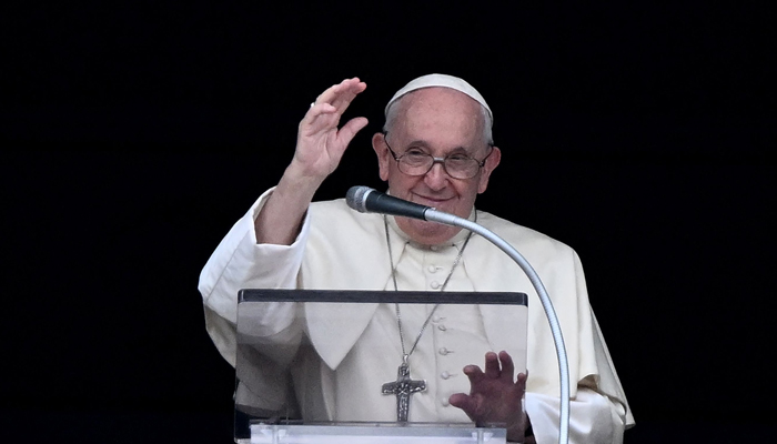 Pope Francis addresses the crowd from the window of the Apostolic palace overlooking St Peters square for the Angelus prayer in the Vatican on July 2, 2023. — AFP