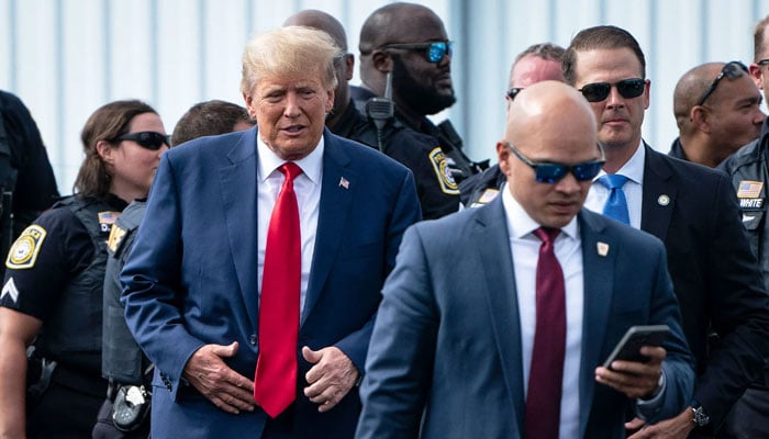 Former President Donald Trump photographed along with his White House-era valet Walt Nauta. The Washington Post